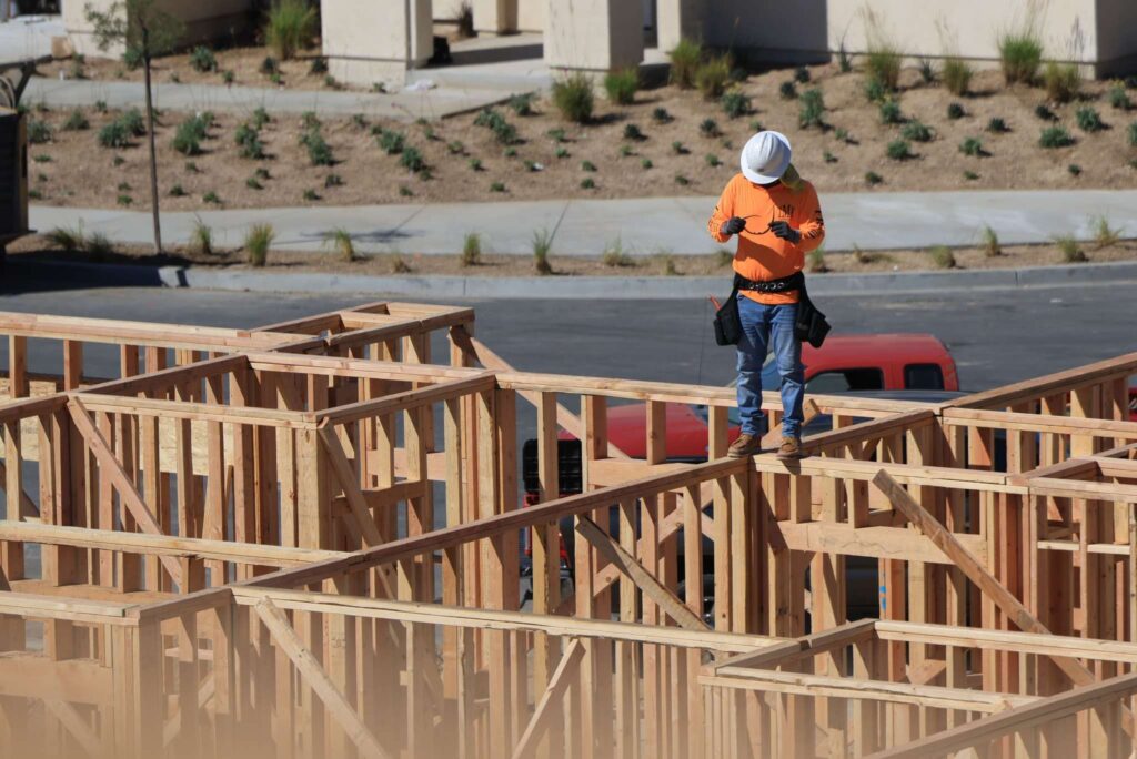 A professional construction crew performing residential framing on a new home